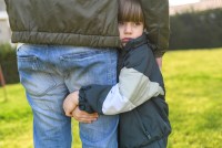 close-up-kid-holding-adult-s-leg.jpg